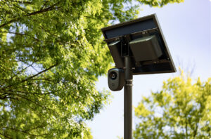 A Flock license plate reader on a pole
